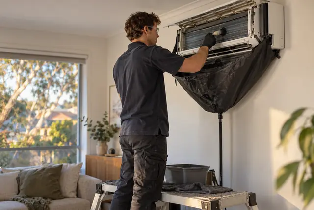 Heating, ventilation & air conditioning: wall-mounted split system clean and service in progress